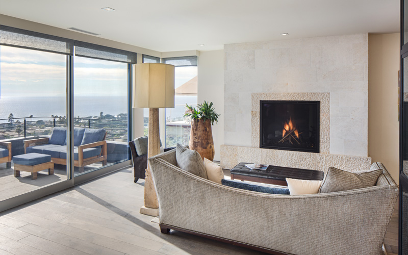 living room details with fireplace and view